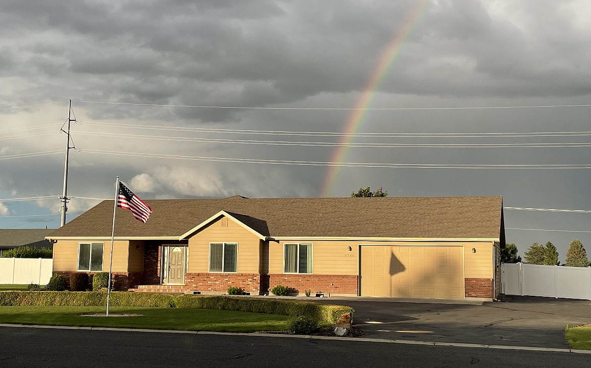 A rainbow touches on a home Alan Heroux has listed for sale. The Moses Lake market has changed a lot, but not nearly as much as in other places, he said.