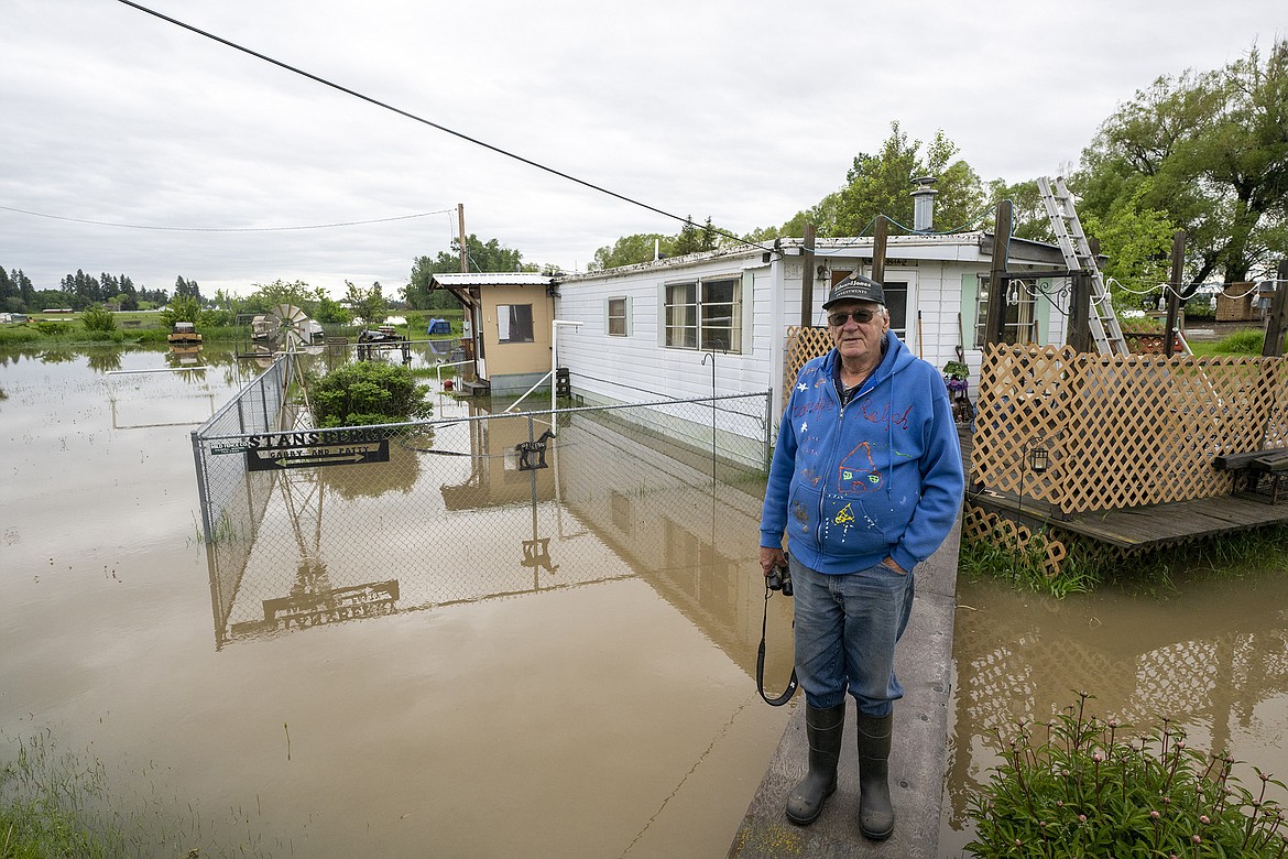 Gary Stansberry stands in floodwaters around his home on Trumble Creek Wednesday morning near Columbia Falls. (Chris Peterson/Hungry Horse News)