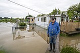 Trumble Creek floods more than a dozen homes, structures; Garnier Creek damages North Hilltop Road