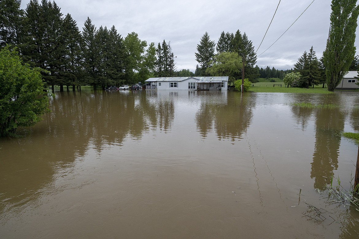 A flooded home along Highway 2 just north of the Blue Moon after Trumble Creek spilled over its banks.