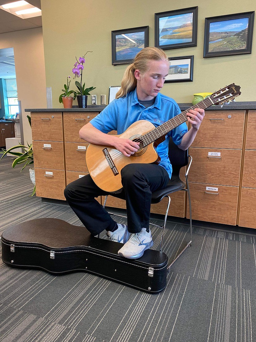 Eli Legault at guitar practice. Legault doesn’t limit his playing to a particular genre, he said; his tastes are all over the map, though he did start out favoring grunge a bit.