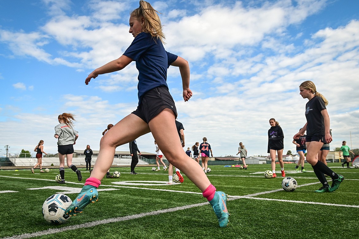 Soccer players practice dribble drills during a Glacier Surf Soccer Club tryout at Legends Stadium on Wednesday, June 15. (Casey Kreider/Daily Inter Lake)