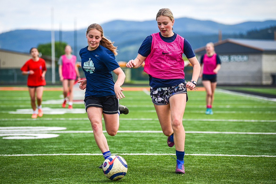 Soccer players scrimmage during a Glacier Surf Soccer Club tryout at Legends Stadium on Wednesday, June 15. (Casey Kreider/Daily Inter Lake)