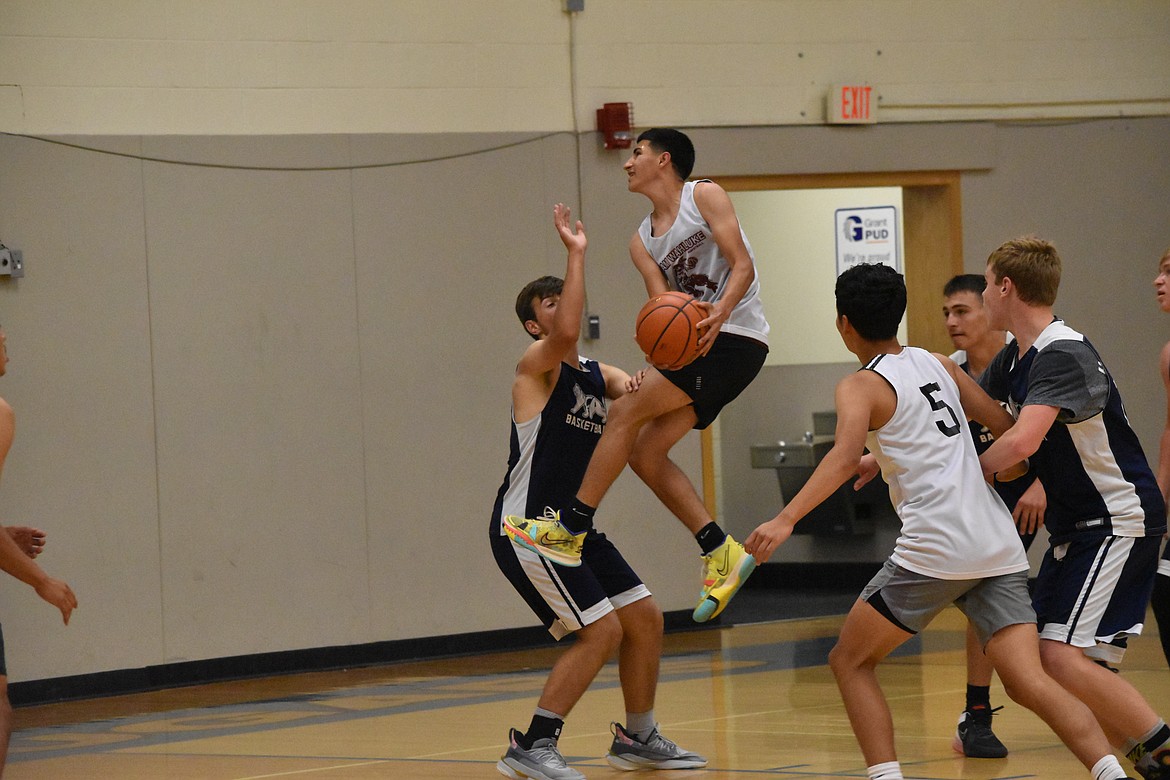 A Wahluke player goes in for a layup in the exhibition game against MLCA/CCS on Wednesday.