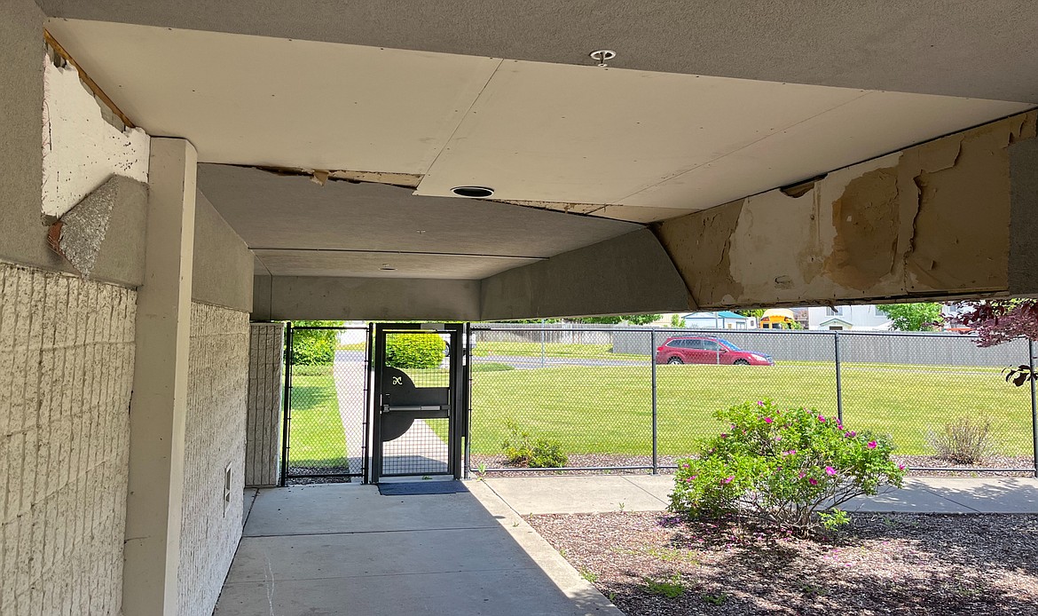 Damaged soffit peels from a leaky roof at Coeur d'Alene High School.