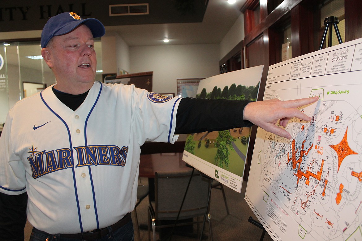 Othello Mayor Shawn Logan points out details in a drawing of options for the new playground in Lions Park. Planning and construction of the new playground had been scheduled for 2022, but probably will be delayed to 2023.