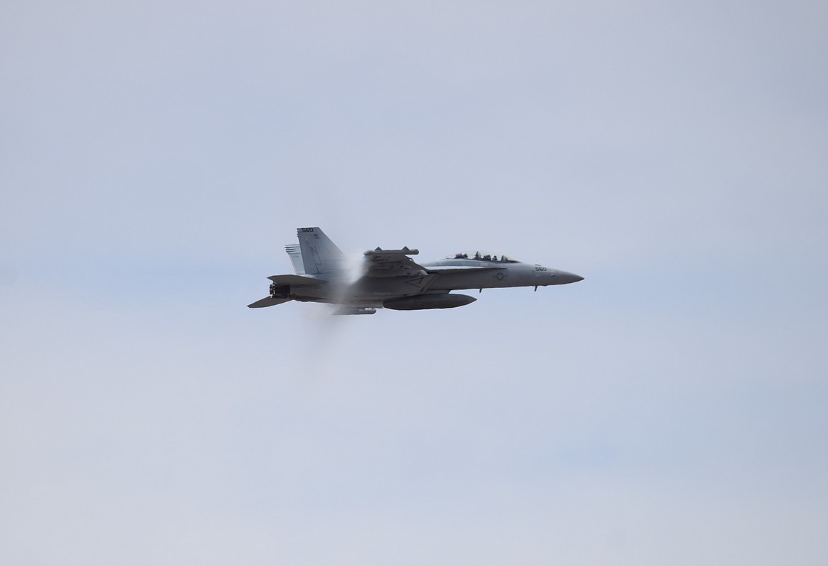 A partial vapor cone forms around a U.S. Navy A/E-18G Growler as it nears the speed of sound during a demonstration flight at the 2022 Moses Lake Airshow on Saturday.