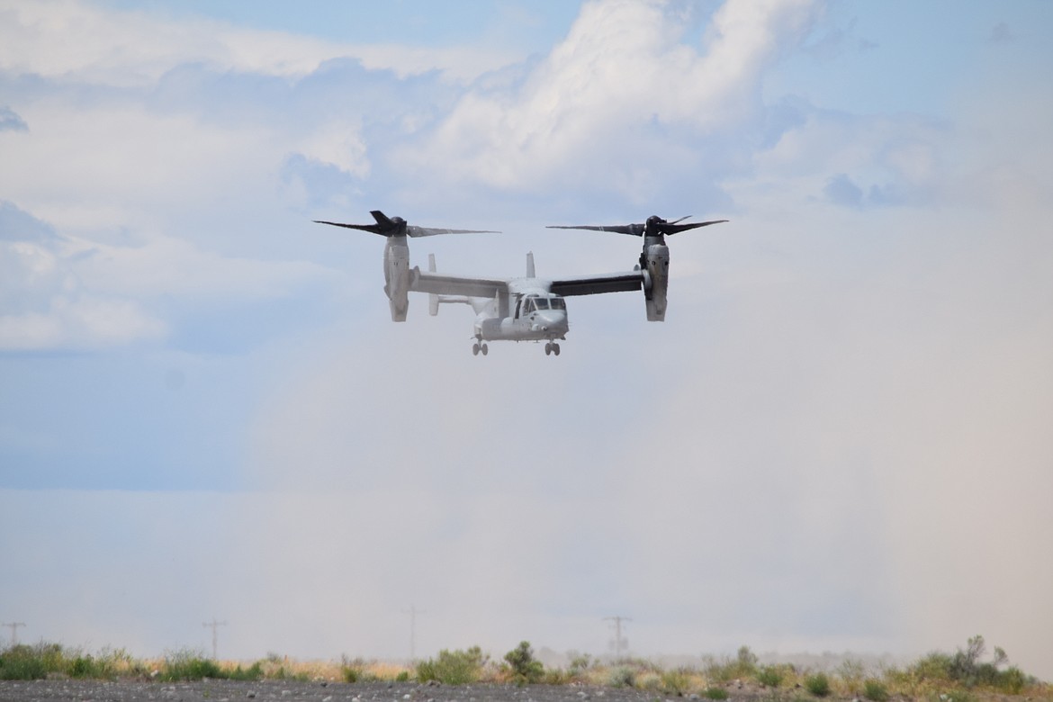 A U.S. Marine Corps MV-22 Osprey transport plane kicks up dust as it hovers over a portion of the Grant County International Airport during the first day of the 2022 Moses Lake Airshow on Saturday. The Osprey’s tilt engines give it the ability to fly like both an airplane and a helicopter.