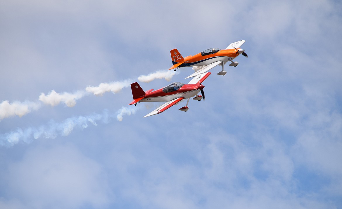 The Undaunted Airshows flying team of Todd Rudberg (in the orange RV8) and Stephen Christopher (in the red RV7) show off their close formation flying skills during the first day of the 2022 Moses Lake Airshow on Saturday.