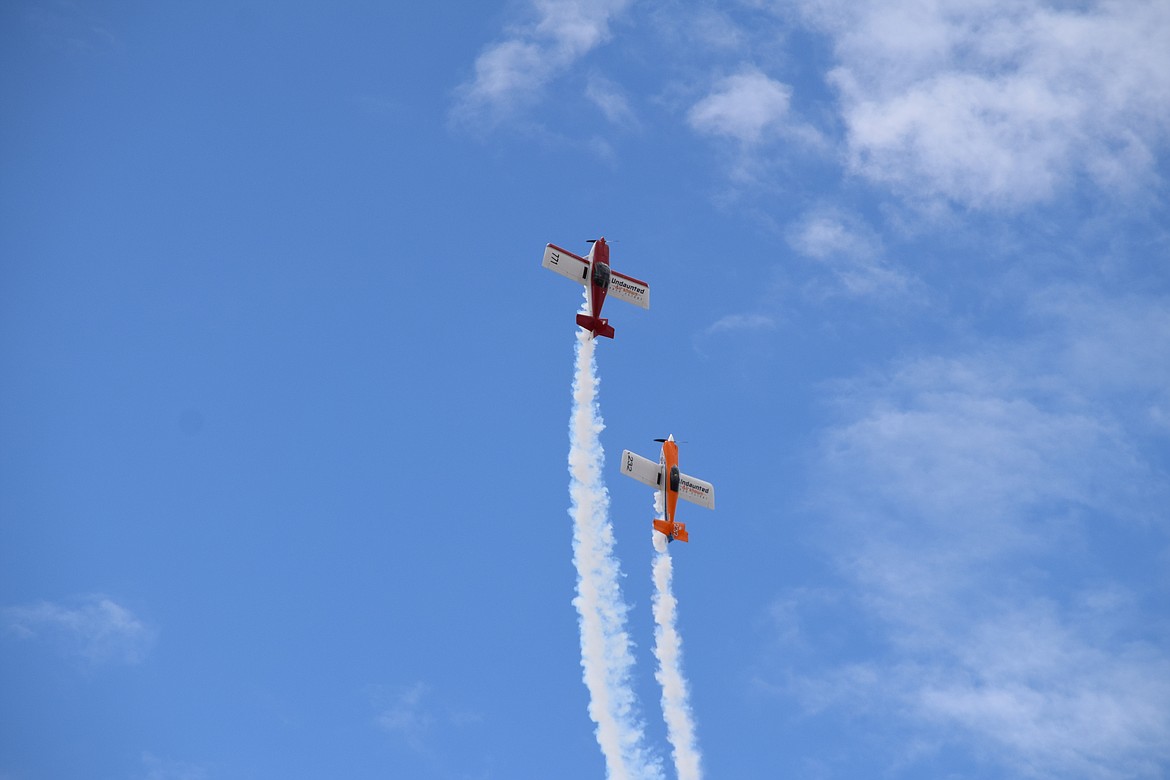 The Undaunted Airshows flying team of Todd Rudberg (in the orange RV8) and Stephen Christopher (in the red RV7) show off their close formation flying skills during the first day of the 2022 Moses Lake Airshow on Saturday.