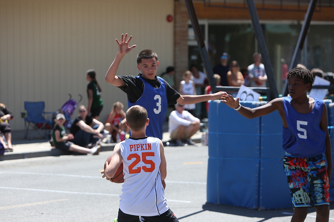 A player rises up to attempt to block a shot in the post during the Dru Gimlin 3-on-3 tournament.