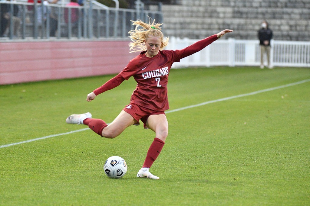 Cougar defender Reese Tappan swings her leg to pass the ball in WSU’s conference matchup against Stanford. WSU announced its 2022 schedule last week.