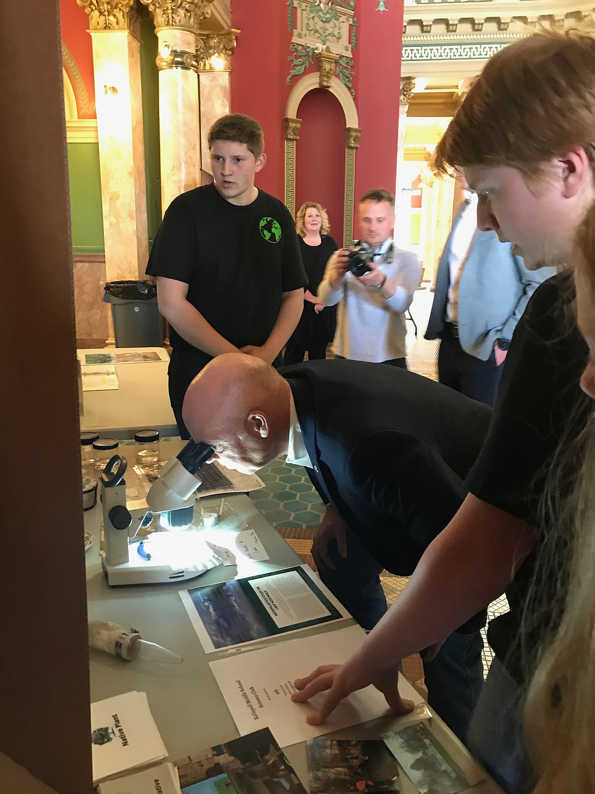 Kalispell Middle School Science Club member Dylan Bauer and Sam Syverson explain their project to Montana Gov. Greg Gianforte during the SMART (Saving Money and Resources Today) Schools Symposium in Helena. (Courtesy Photo)