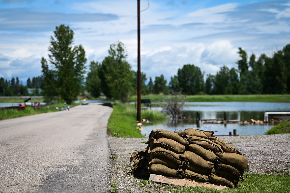 Sandbags are piled at the end of a driveway along Wagner Lane after a pre-evacuation notice was issued by the Flathead County Sheriff’s Office on Tuesday, June 21. (Casey Kreider/Daily Inter Lake)