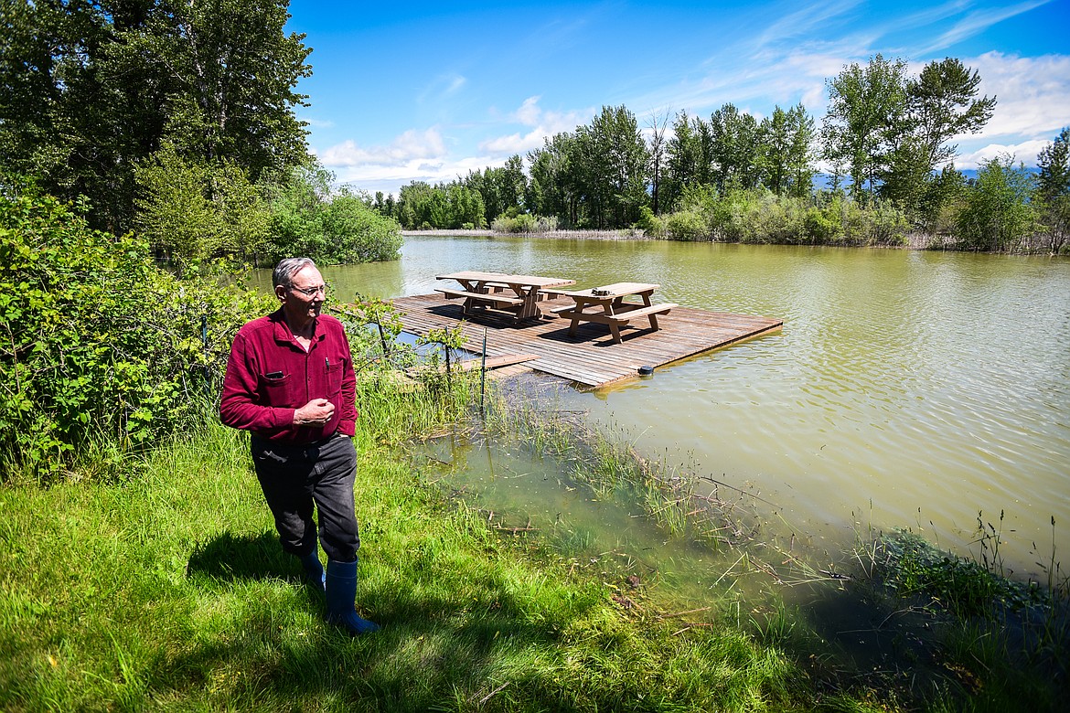 Verdell Jackson stands in the backyard of his residence along Wagner Lane as floodwaters from the Flathead River rise up around his deck on Tuesday, June 21. (Casey Kreider/Daily Inter Lake)