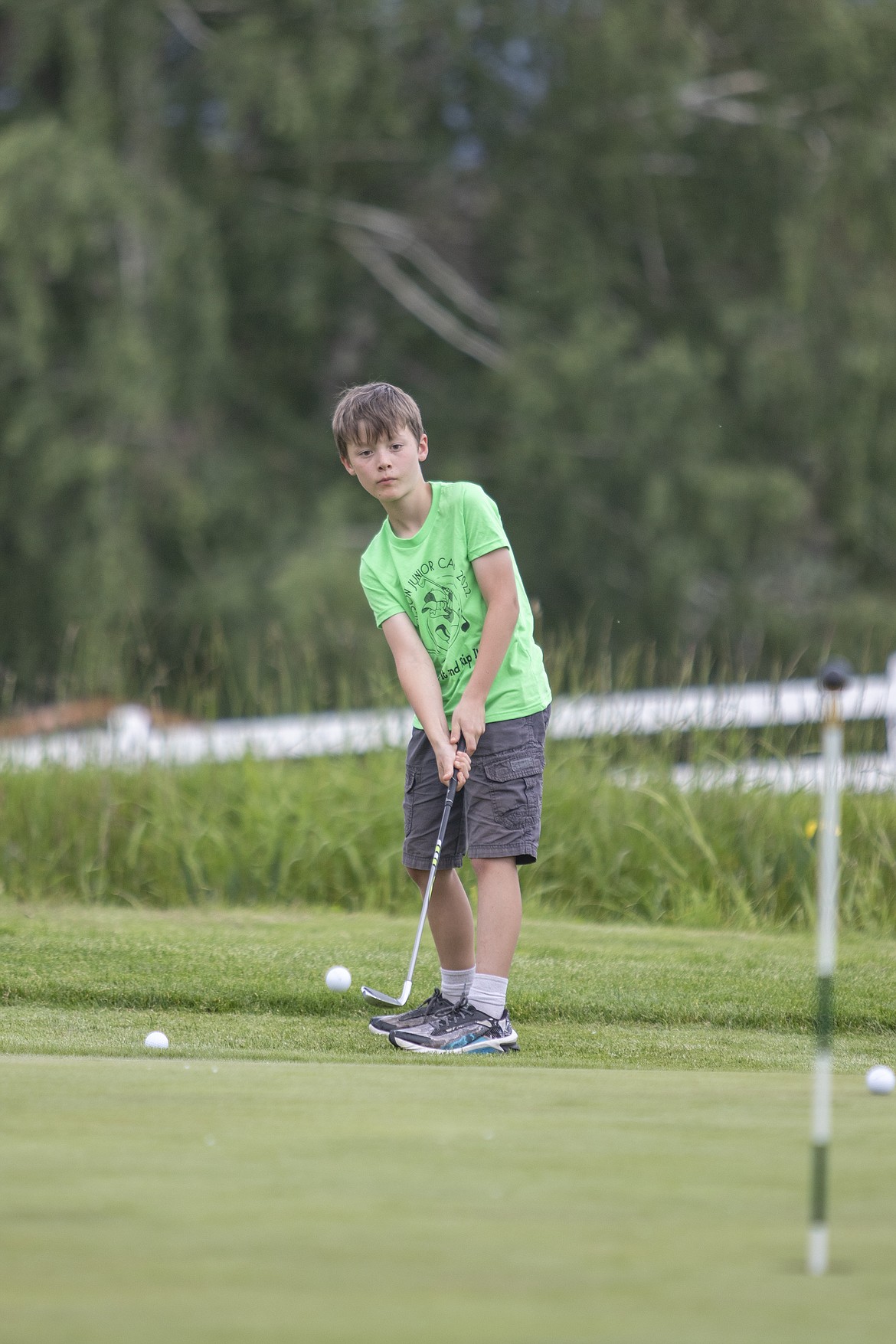 Gabe Blood makes a nice shot during the Junior Camp Pitch, Putt, and Drive Competition held at the Polson Bay Golf Course on Friday.