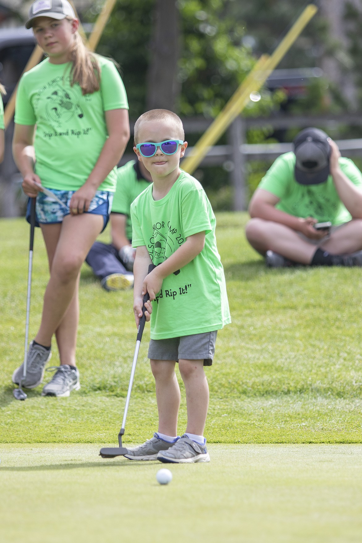 Oscar Jones watches his putt inch its way to the cup during the Junior Camp Pitch, Putt, and Drive Competition held at the Polson Bay Golf Course on Friday.