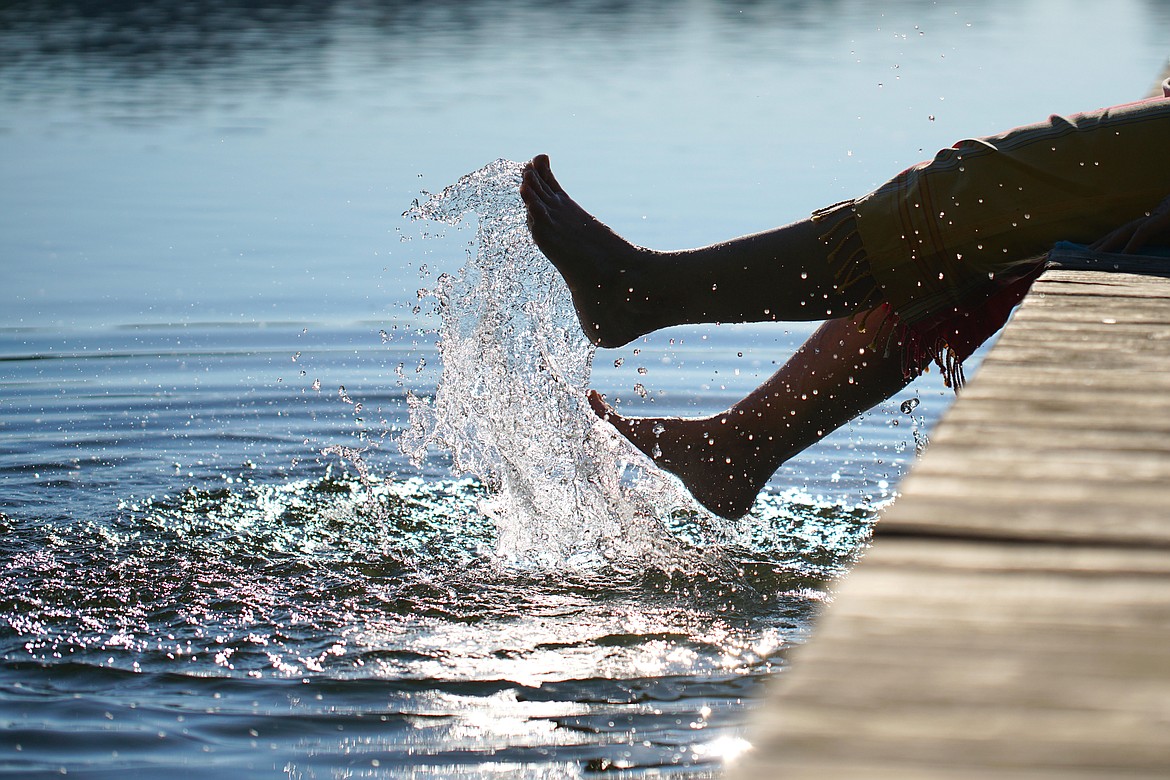 A person kicks water on a dock in Flathead Lake. (photo provided)