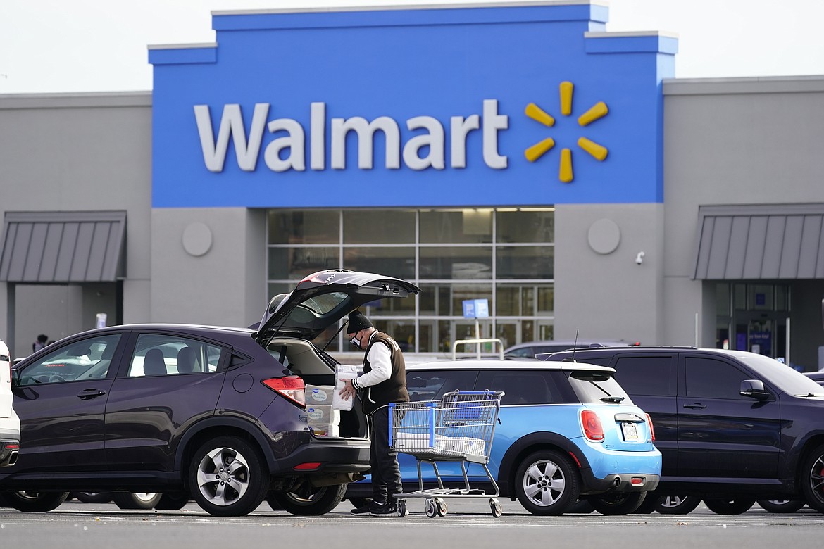 FILE - Shown is a Walmart location in Philadelphia, Wednesday, Nov. 17, 2021. Walmart, the nation’s largest retailer, on Wednesday, June 22, 2022, is expanding its healthcare coverage of so-called doula services beyond its workers in Georgia to Louisiana, Indiana and Illinois in an effort to address racial inequities in maternal care. With this move, workers can take advantage of financial support to cover care by doulas— experts who are trained to help support mothers through the labor process and delivery of the child _ up to $1,000 per pregnancy. (AP Photo/Matt Rourke)