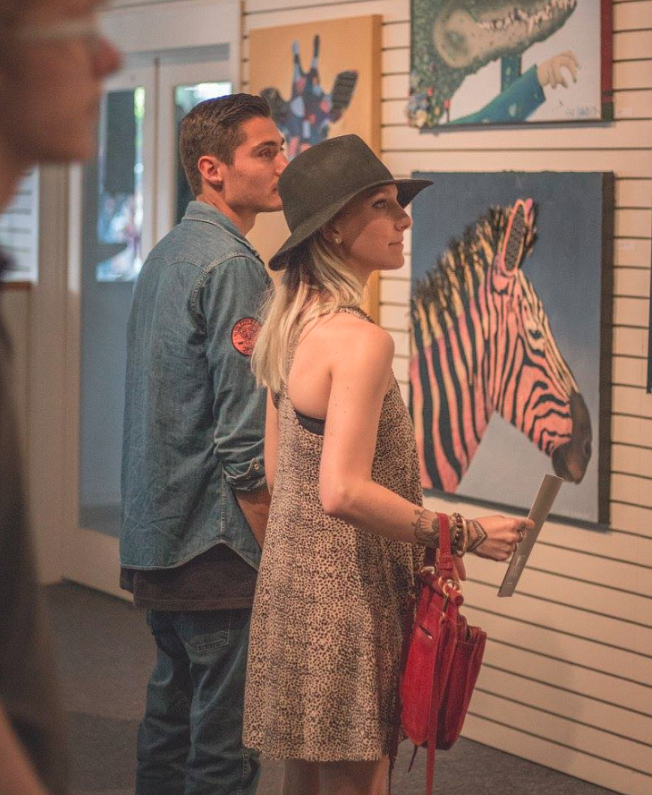 Art enthusiasts enjoy works of art during a past Emerge Pop-Up Show. This year's event has a new name, the Block Party, and will be held at Emerge from 5 p.m.