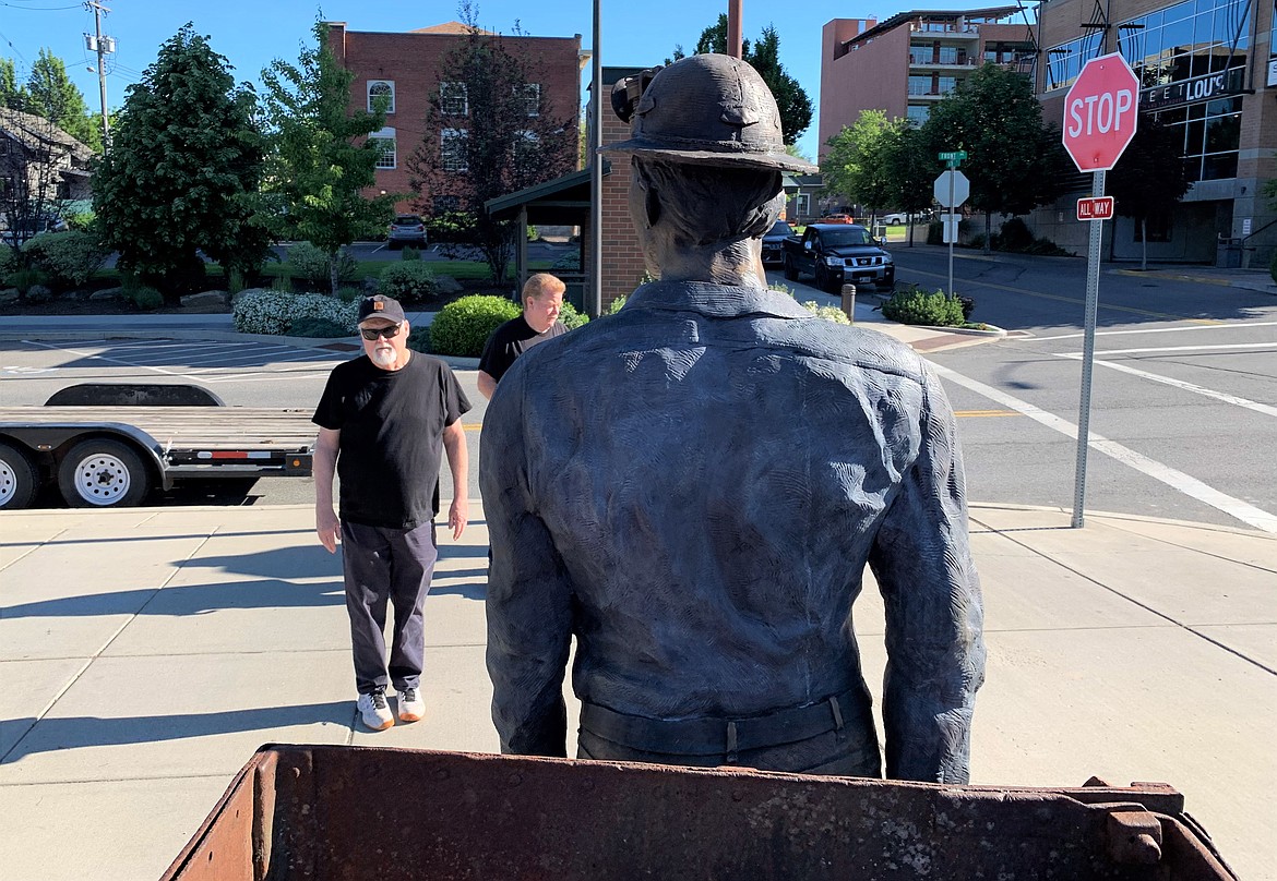 Terry Lee looks over The Miner after the bronze statue was installed Wednesday at Sixth and Front in Coeur d'Alene.