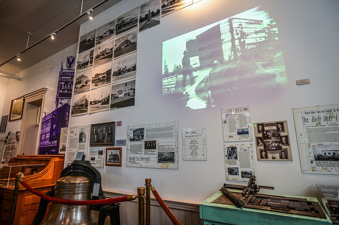 A projector shows scenes filmed in Kalispell in 1937, part of the Northwest Montana History Museum's collection that was digitized with help from Bruer Video Productions, at the "Kalispell: Montana's Eden" exhibit on Thursday, June 23. (Casey Kreider/Daily Inter Lake)