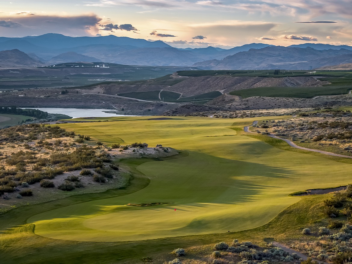 The third hole at the Gamble Sands golf resort gives a panoramic view of Brewster-area orchard country.