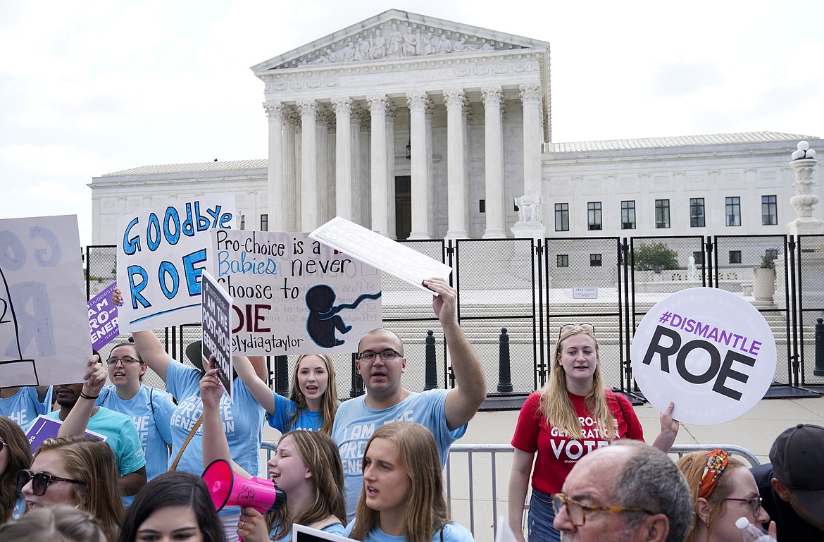Demonstrators protest about abortion outside the Supreme Court in Washington, Friday, June 24, 2022.The Supreme Court has ended constitutional protections for abortion that had been in place nearly 50 years in a decision by its conservative majority to overturn Roe v. Wade. Friday's outcome is expected to lead to abortion bans in roughly half the states. (AP Photo/Jacquelyn Martin)