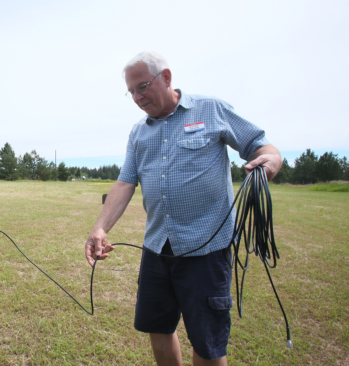 Kootenai Amateur Radio Society member Frank Krug unravels cables on Friday while setting up for Amateur Radio Field Day.