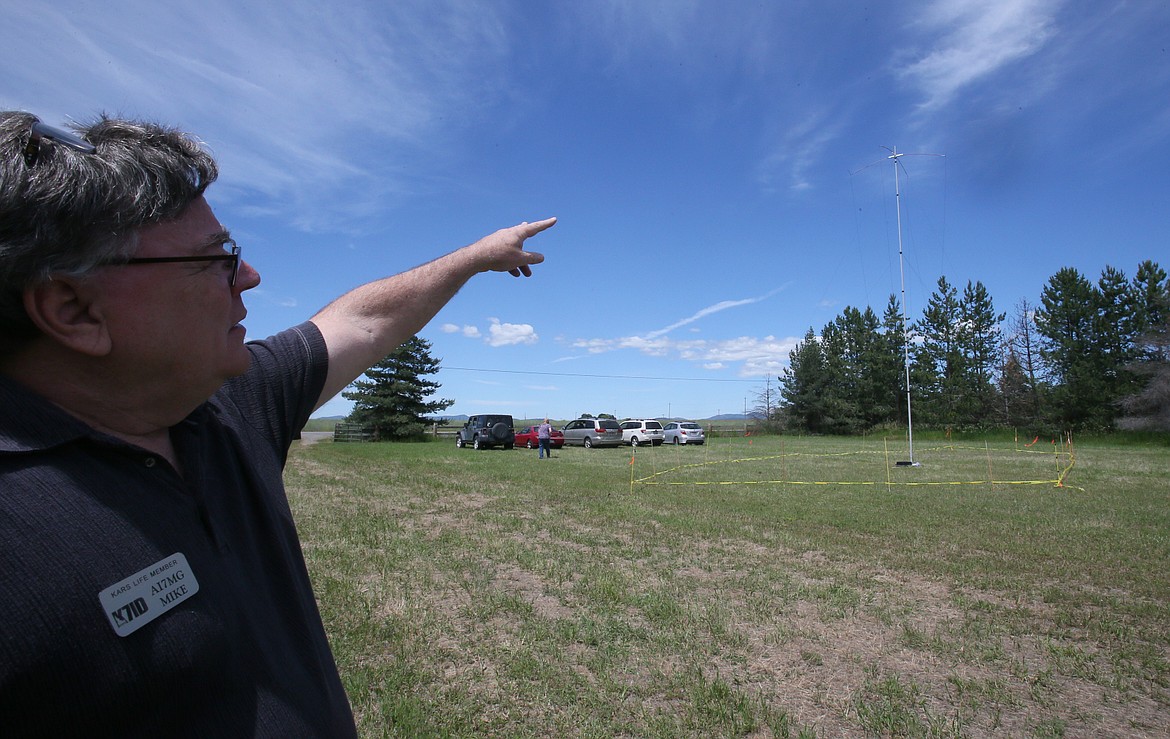 Kootenai Amateur Radio Society executive director and life member Mike Glauser shows where a double inverted delta skeleton slot antenna is stationed at this year's Amateur Radio Field Day.