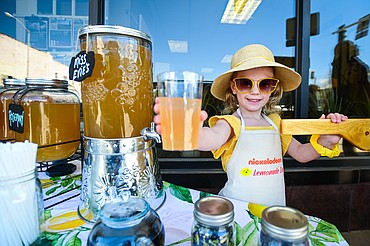 Everley Journey Beck serves a cup of Lavender Lemonade at her Miss Evie's Lemonade stand as part of Lemonade Day in Kalispell on Saturday, June 25. Everley's stand won "Most Creative Ingredient" for her addition of Butterfly Pea Flower. The national Lemonade Day program helps youth learn about starting a business, via the one-day stands. Through guided lessons in their Lemonade Day booklet, they learn about budgeting, finance, site selection, product creation, supplies, staffing, and more. (Casey Kreider/Daily Inter Lake)