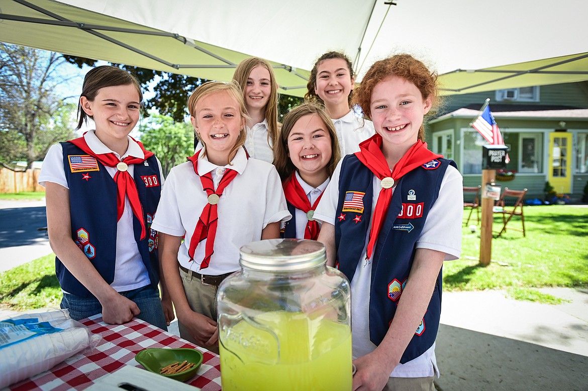 American Heritage Girls, from left, Cassia Dezell, Sarah Bott, Aria Dezell, Ezri Gibbons, Charlotte Gibbons and Elizabeth Jones operate their Lemonade for Charity stand as part of Lemonade Day in Kalispell on Saturday, June 25. The national Lemonade Day program helps youth learn about starting a business, via the one-day stands. Through guided lessons in their Lemonade Day booklet, they learn about budgeting, finance, site selection, product creation, supplies, staffing, and more. (Casey Kreider/Daily Inter Lake)