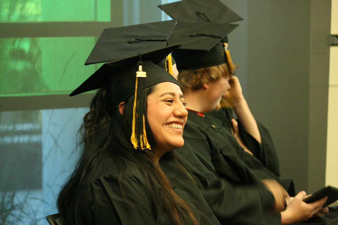 A newly graduated Open Doors student smiles at her family after receiving her diploma Thursday.