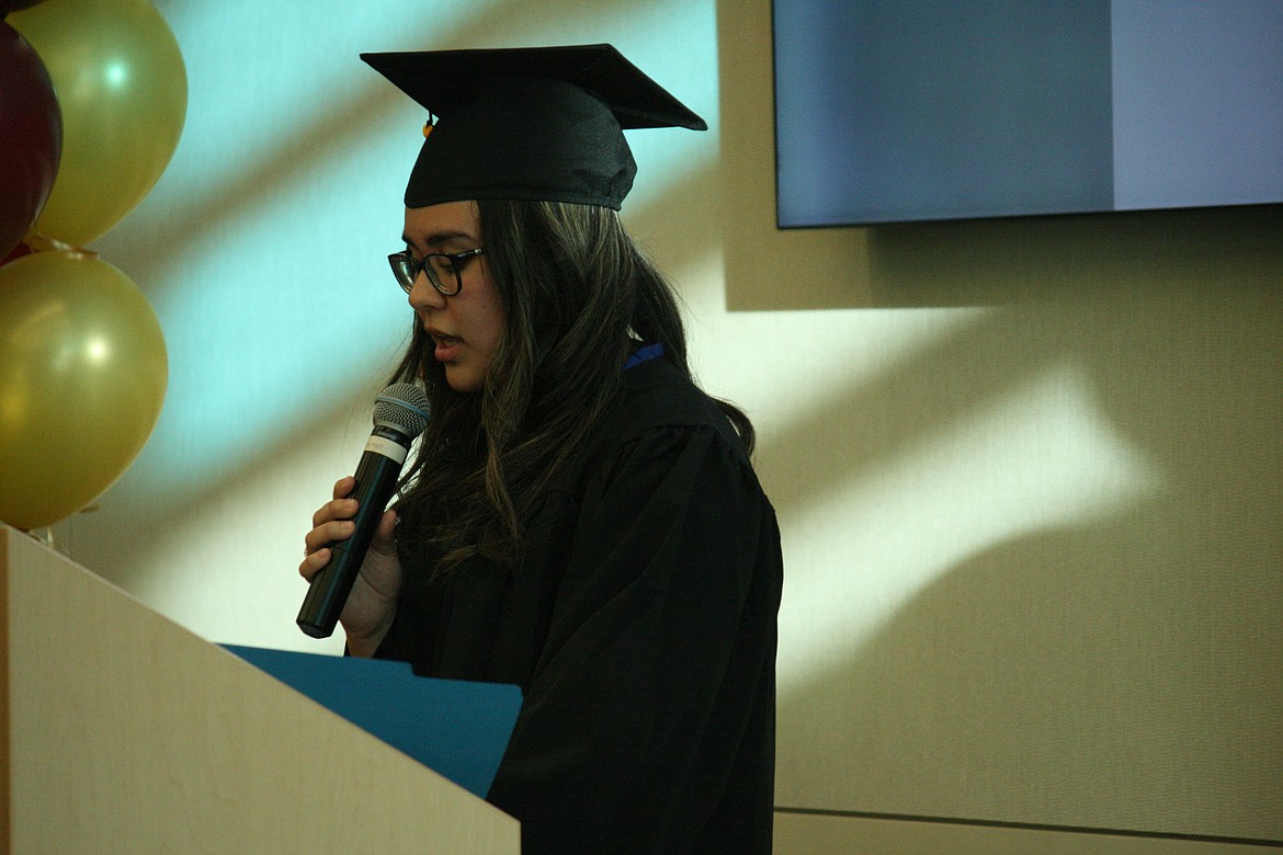 Open Doors student speaker Cynthia Velazquez recounts her experiences during the graduation ceremony Thursday.