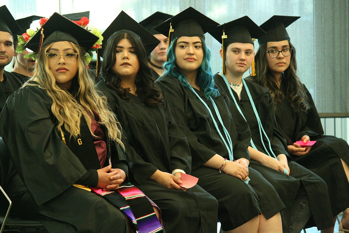 Open Doors students listen to the speakers during Thursday’s graduation ceremony.