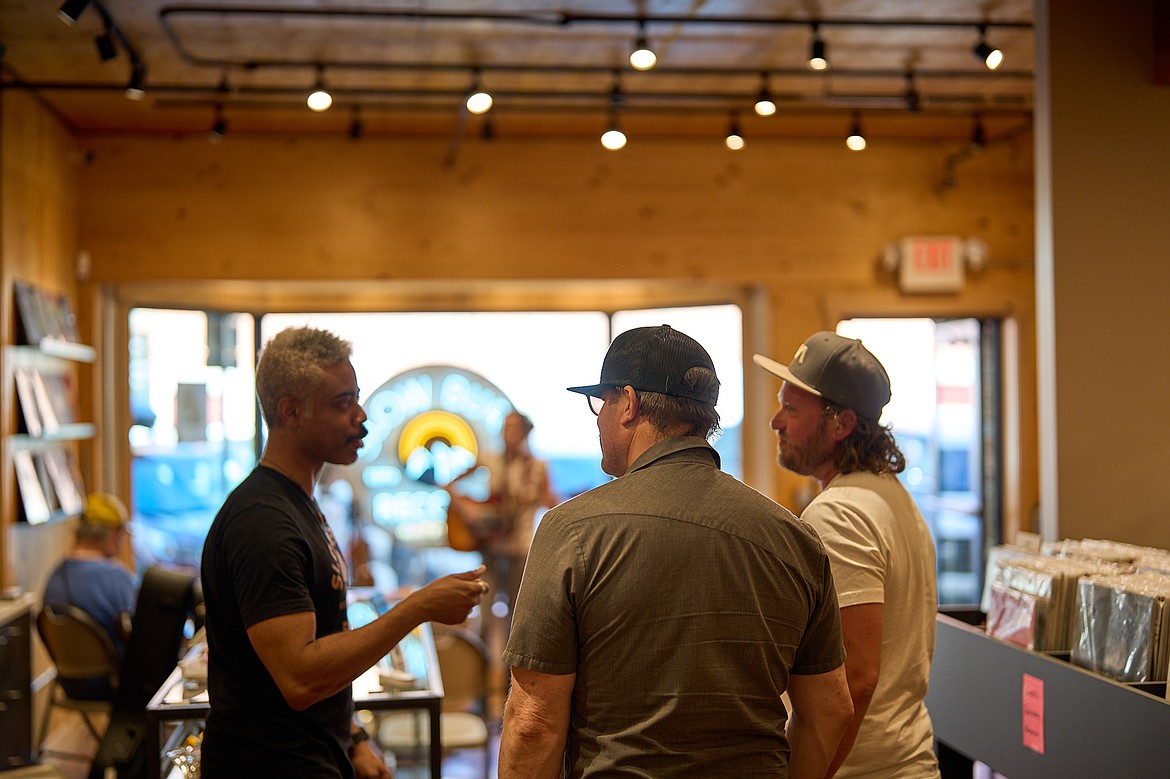 General manager, Bernard Jones, helps customers at Slow Burn Records in Whitefish. (Alejandro Dinsmore photo)