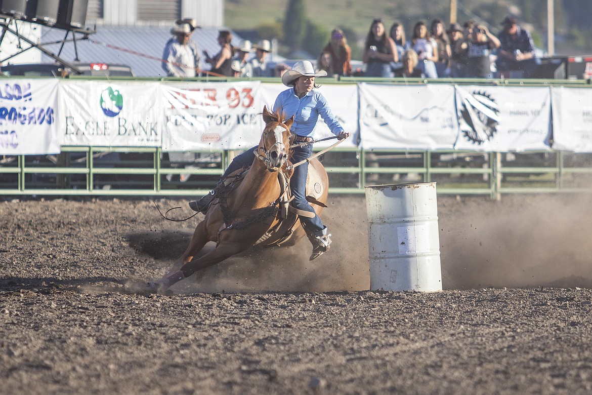 Ronan cowgirl Madeline Clary races around barrel No. 2 during the Mission Mountain Rodeo on Saturday evening. (Rob Zolman/Lake County Leader)