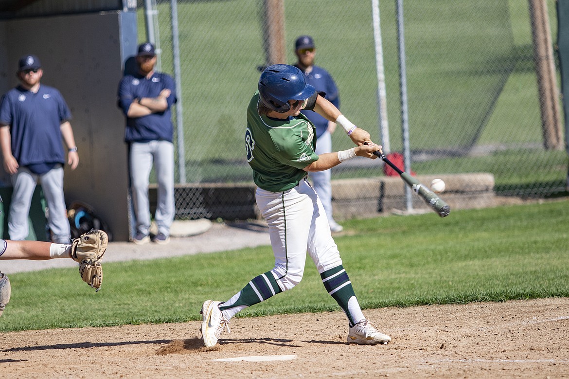 Mariner Xavier Fisher drives it deep for a mase hit.