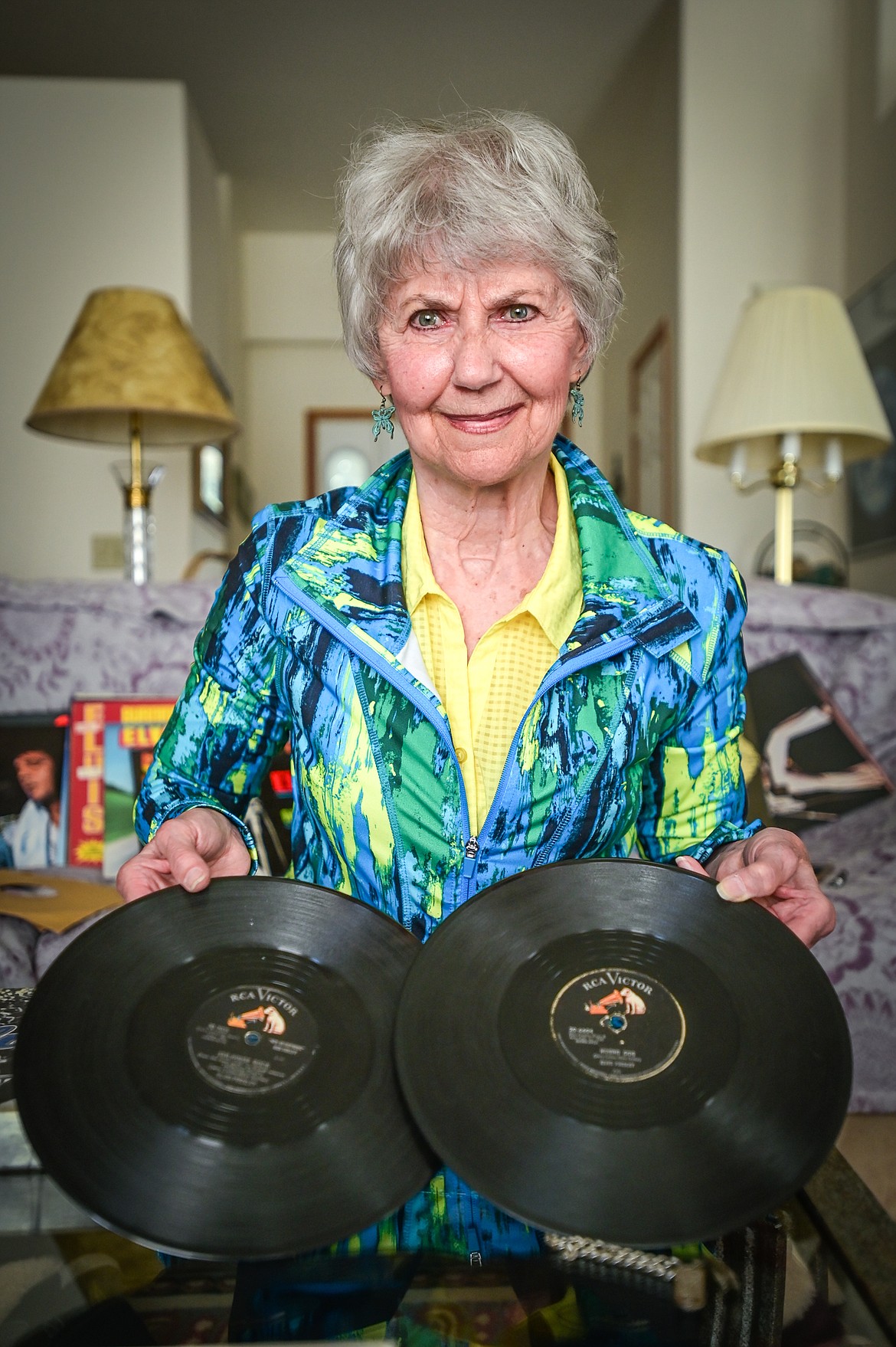 Priscilla Alden French shows two of her Elvis Presley 78 RPM records "Jailhouse Rock" and "Hound Dog" at her residence on Tuesday, June 28. (Casey Kreider/Daily Inter Lake)