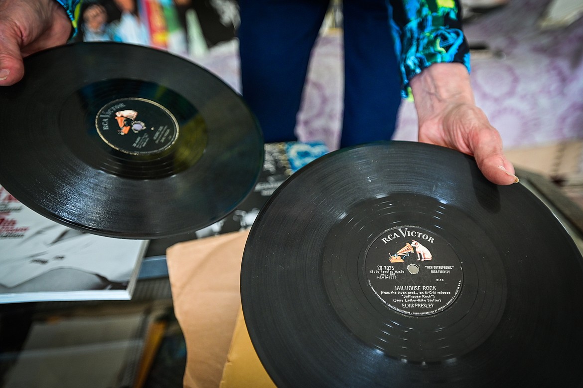 Priscilla Alden French shows two of her Elvis Presley 78 RPM records "Jailhouse Rock" and "Hound Dog" at her residence on Tuesday, June 28. (Casey Kreider/Daily Inter Lake)
