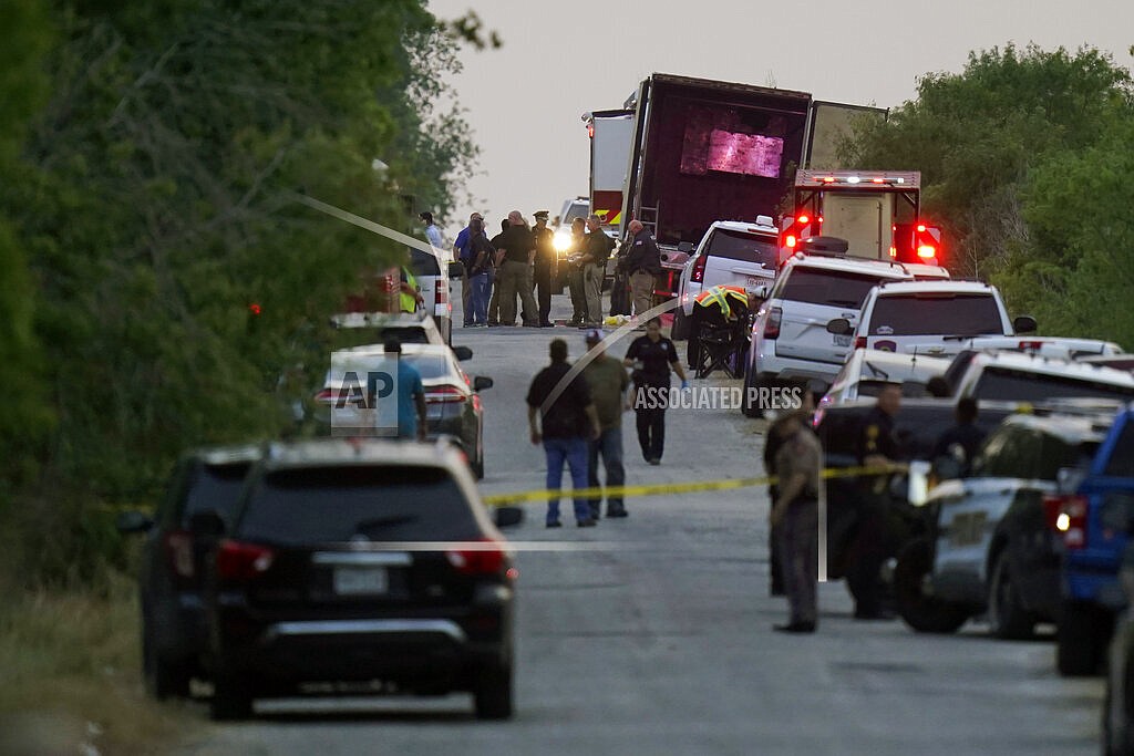 Police and other first responders work the scene where officials say dozens of people have been found dead and multiple others were taken to hospitals with heat-related illnesses after a semitrailer containing suspected migrants was found, Monday, June 27, 2022, in San Antonio. (AP Photo/Eric Gay)