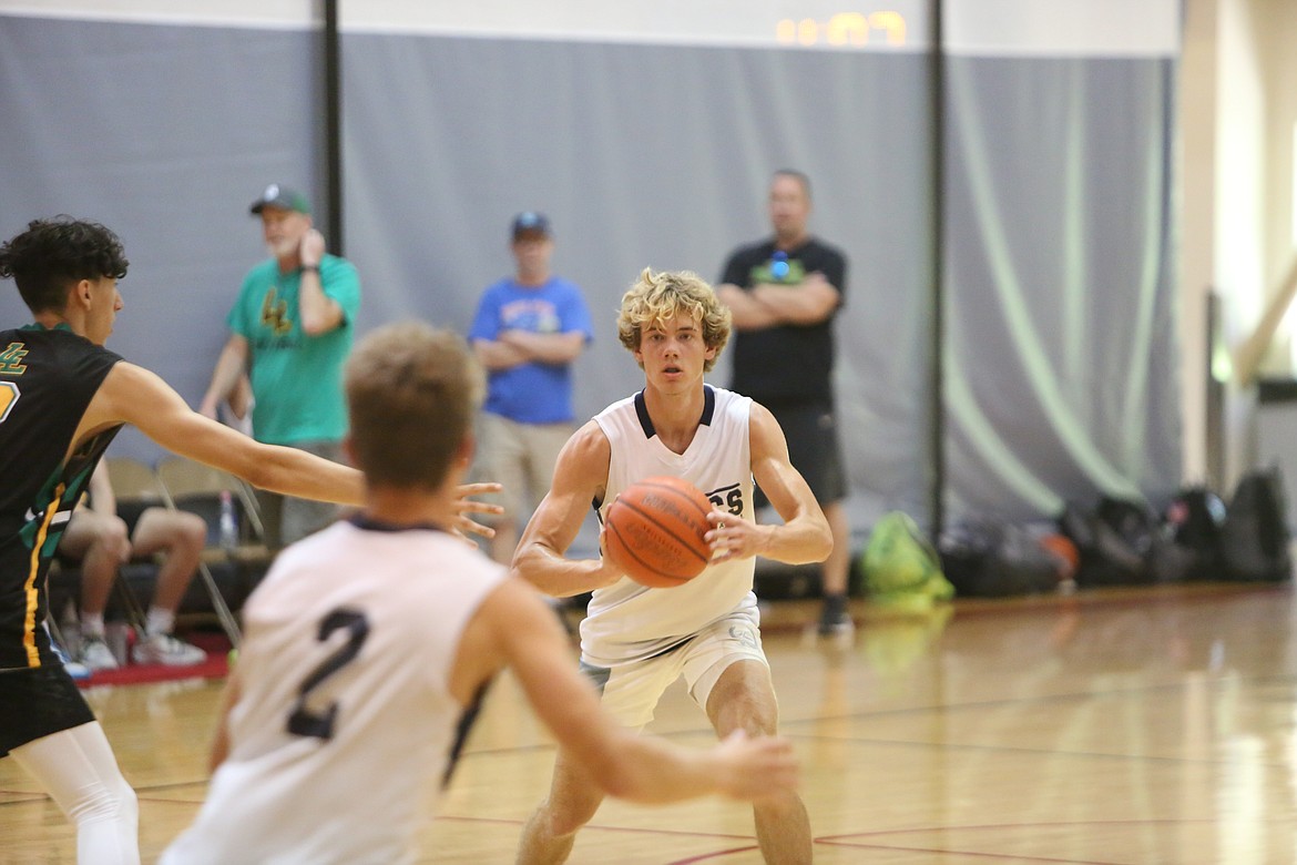 A Lynden Christian defender looks to pass away to another teammate in the CWU MBB team camp on June 28.