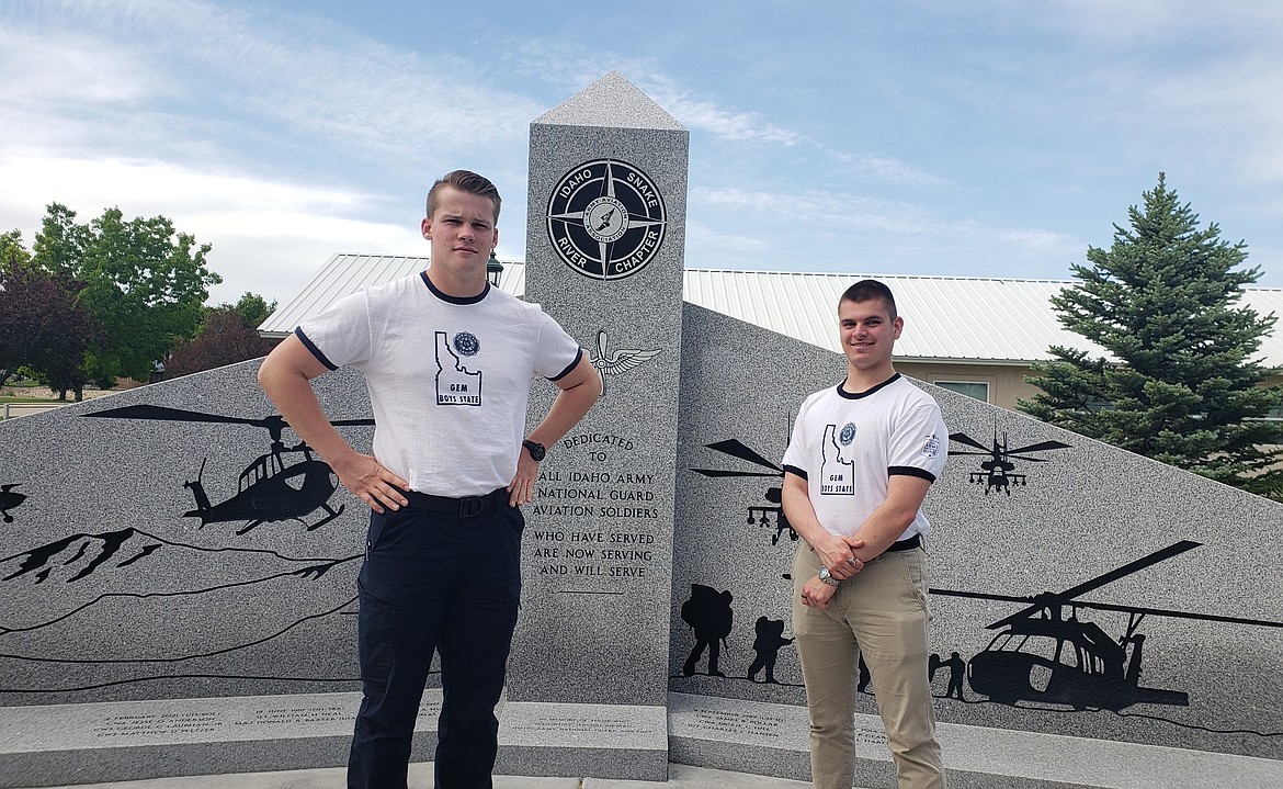 Austin Mahnke, left, and Jayden LaVecchia stand near a statue dedicated to Idaho Army National Guard aviation soldiers during their visit to Boise for the American Legion Gem Boys State program in mid-June.