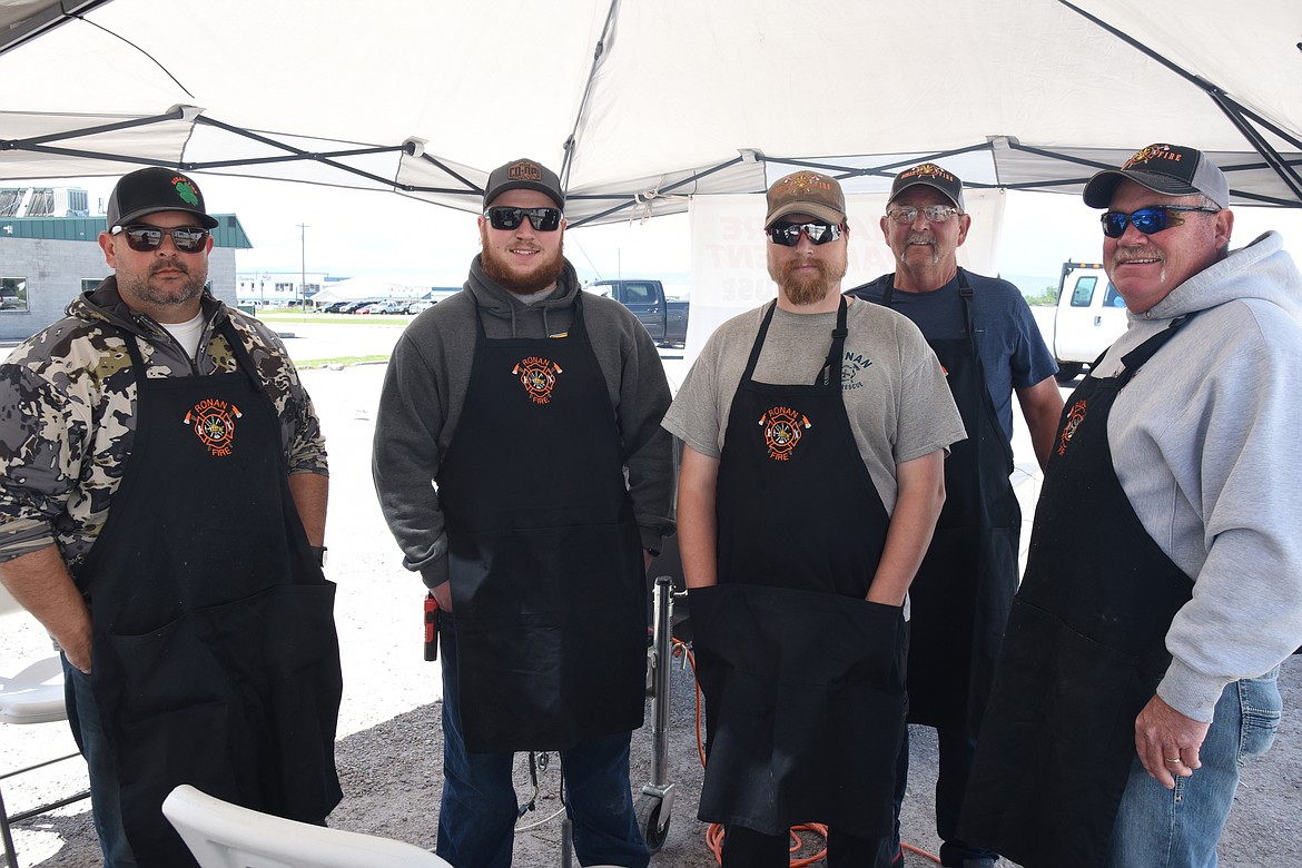 Chris Atkison, Michael BaysTim Farnsworth, Troy Benson, and Dave Marmon take a break from preparing tri-tips. (Marla Hall photo)