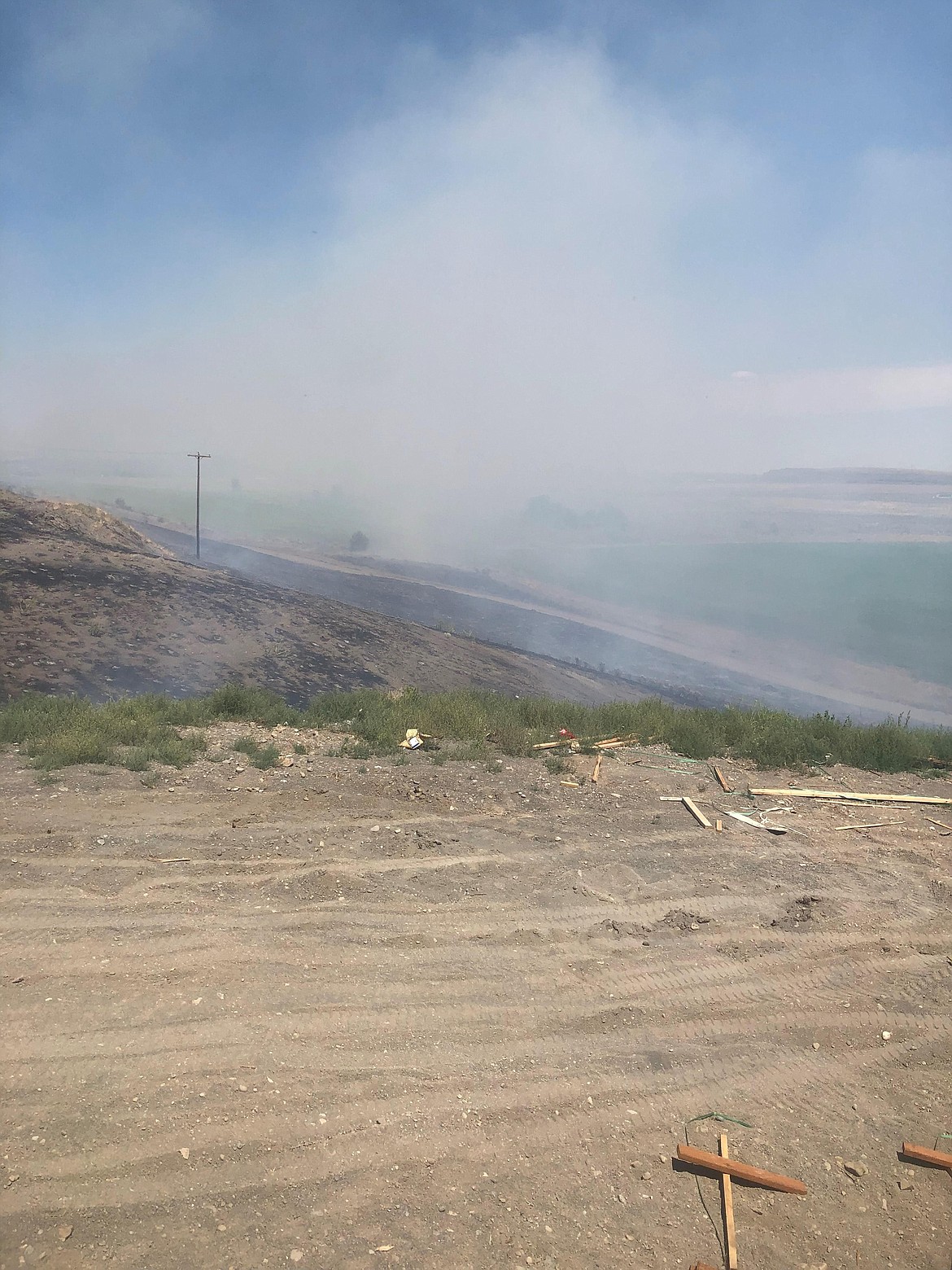 Smoke from a fire along S.R. 28 between Soap Lake and Stratford on Monday. The fire prompted the Grant County Sheriff's Office to issue a Level 3 evacuation order affecting roughly 20 homes and prompted firefighters from as far away as Wilson Creek to respond.