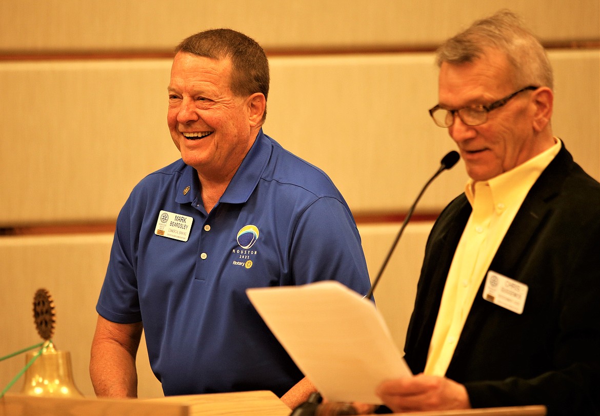 Mark Beardsley, left, laughs after accepting the gavel as president of the Coeur d'Alene Sunrise Rotary Club from Chris Guggemos, now past-president, on Tuesday at The Coeur d'Alene Resort.
