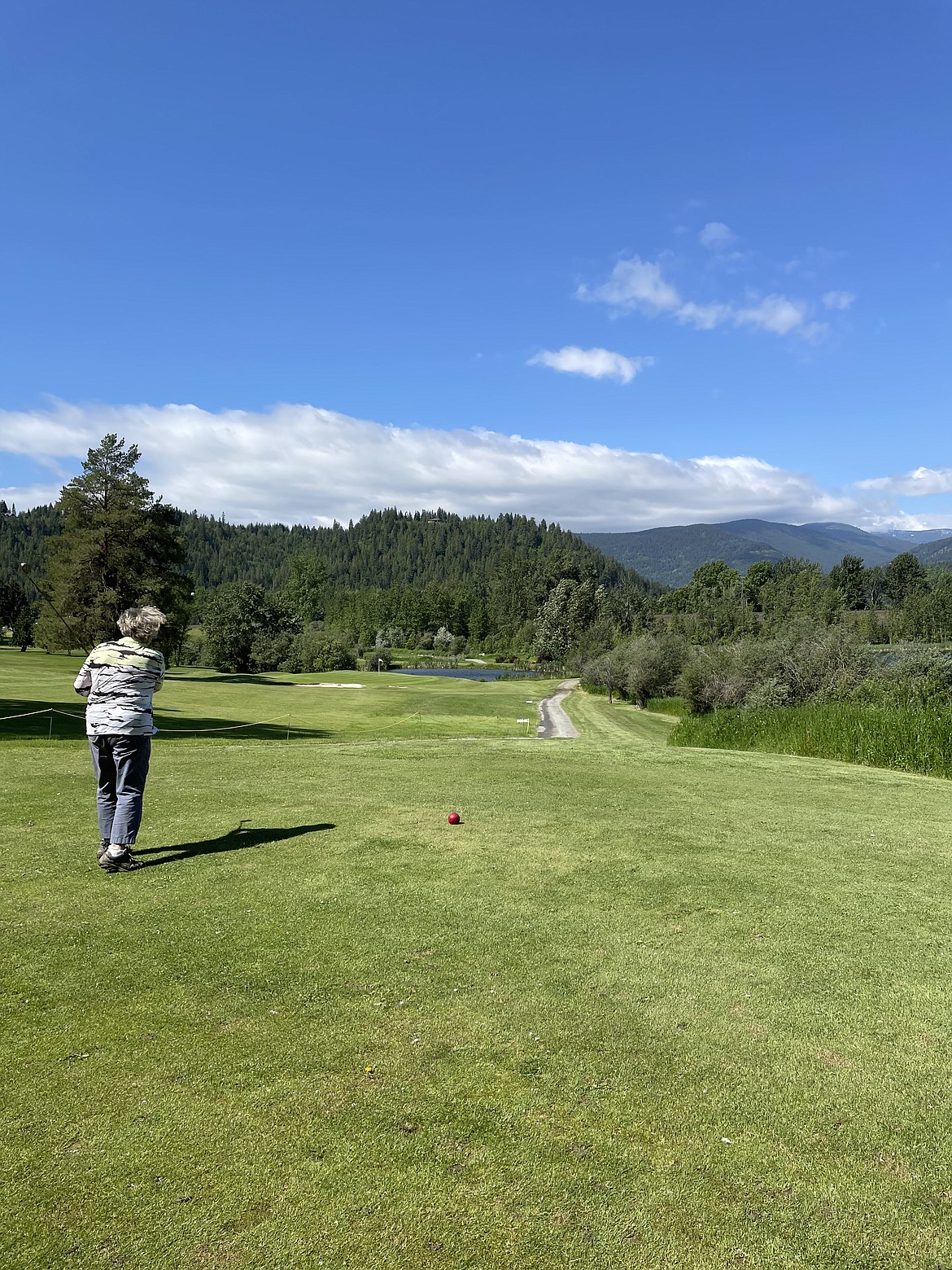 Linda Bogden finishes her drive on Hole No. 3 at the Mirror Lake Golf Course.