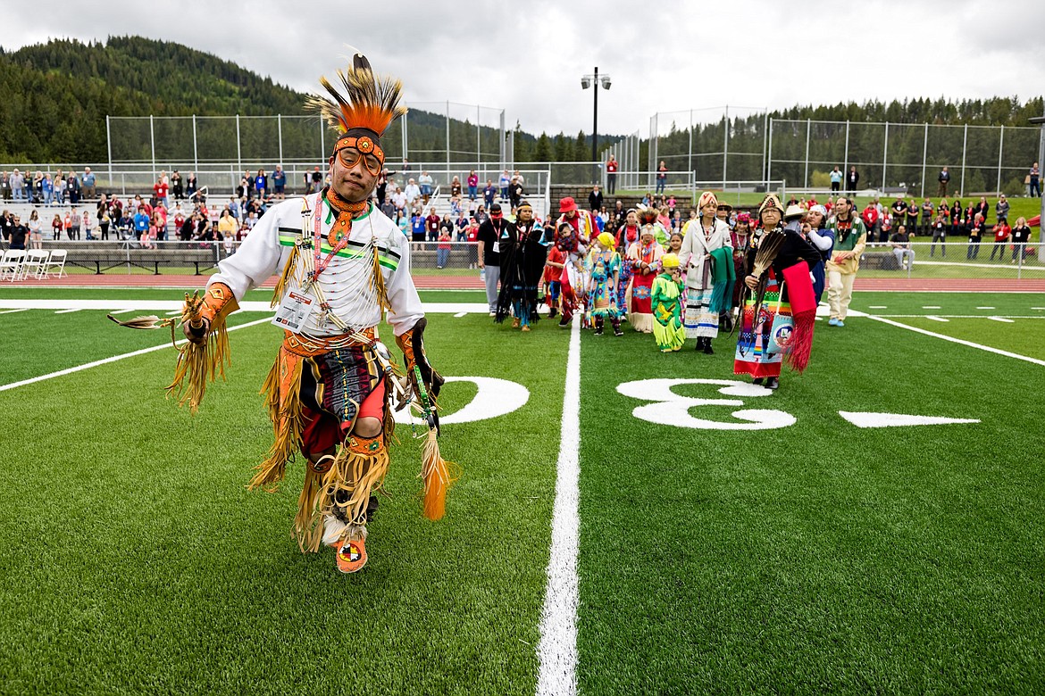 Traditional dancer Frankie Skwanqhqn participates in the grand entry during the opening celebration of the Marimn Health Coeur Center on June 10.