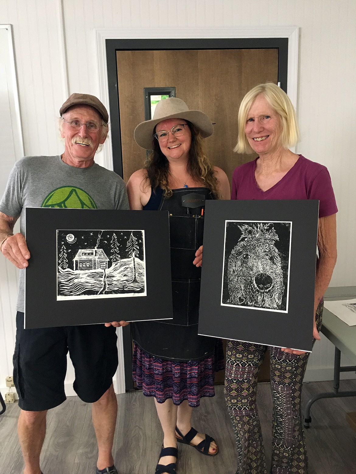 Showing off their artistic skills learned at POAC’s Joyce Dillon Studio adult art class with Lindsey Falciani, center, are Peter, left, and Lorel Boas.