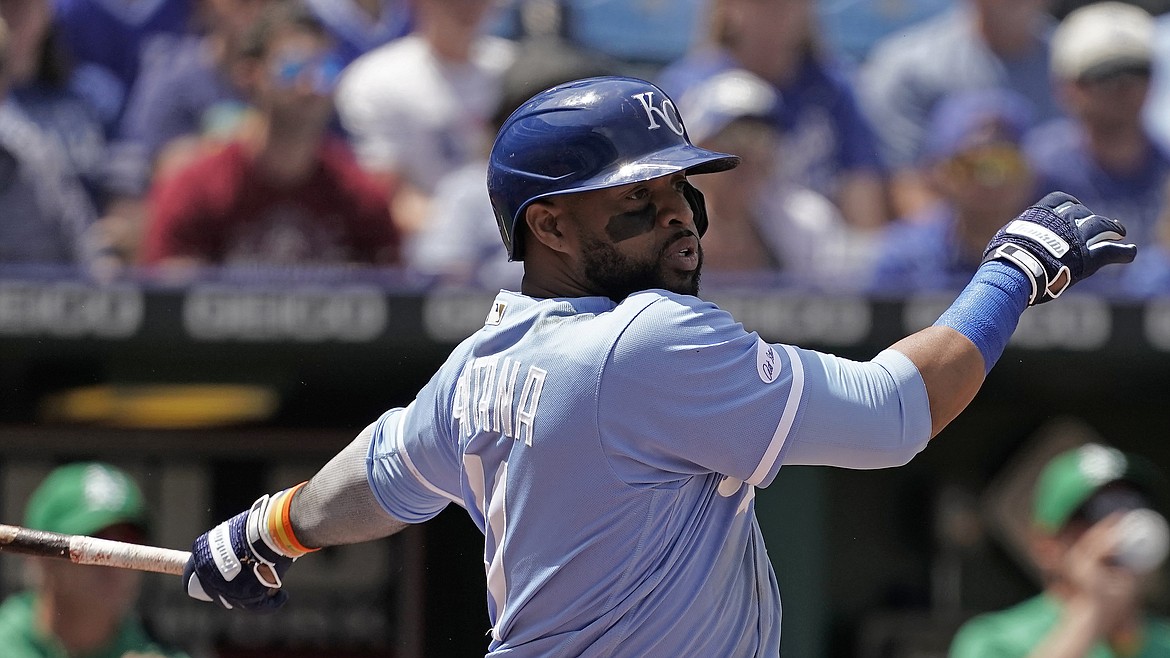 Kansas City Royals' Carlos Santana bats during the sixth inning of a baseball game against the Oakland Athletics Sunday, June 26, 2022, in Kansas City, Mo. The Royals recently traded Santana to the Mariners.